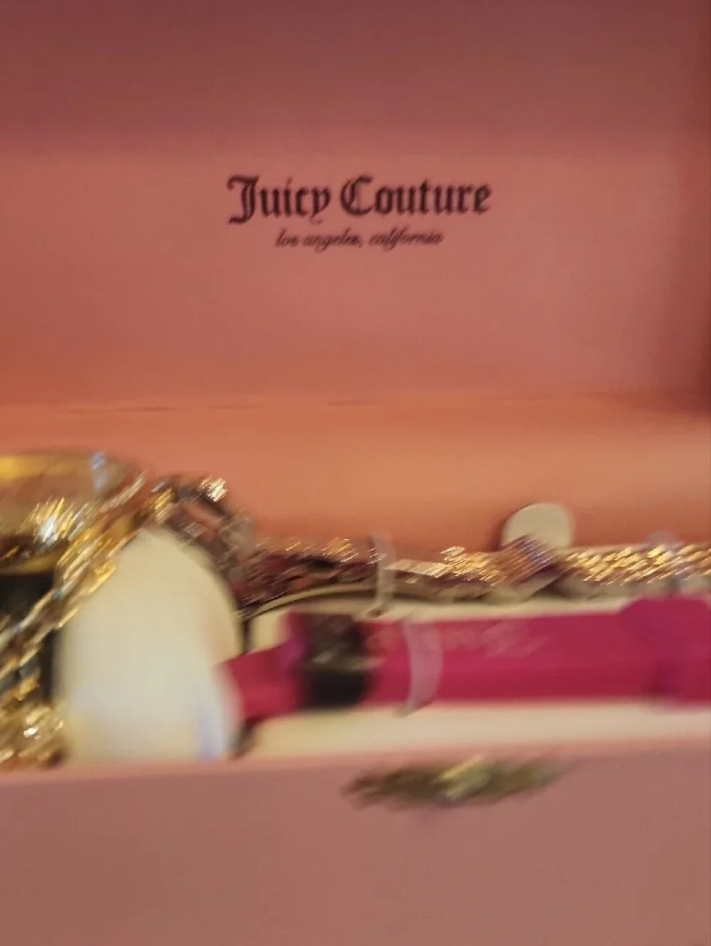 Juicy Couture gold tone